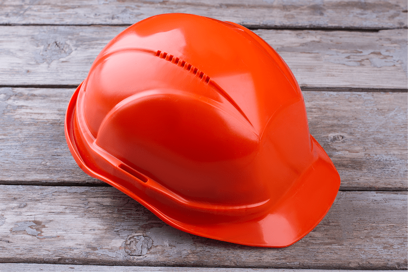 orange-industrial-protective-helmet-on-wooden-back-2026-01-05-00-44-35-utc 1